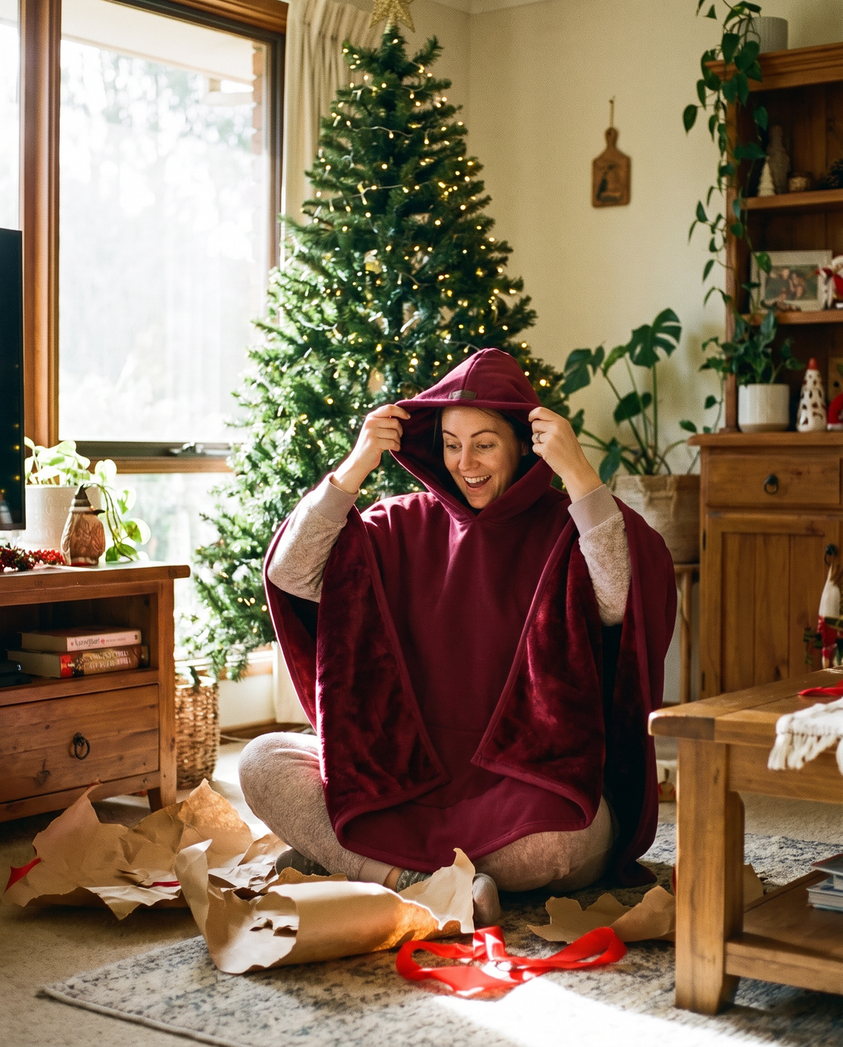 Woman unwrapping a merlot Heavy Hug on Christmas morning